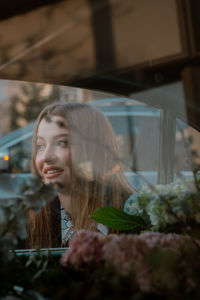 Portrait of young woman looking at camera