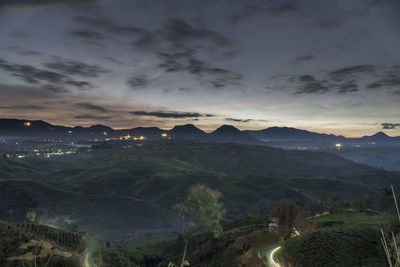 Scenic view of landscape against sky at sunset