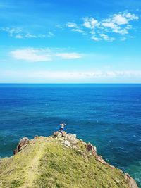 Scenic view of sea against blue sky