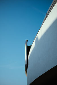 Low angle view of building against clear blue sky