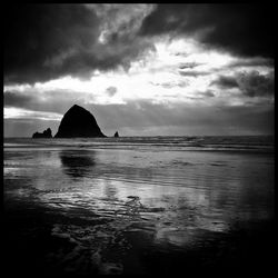 Scenic view of sea against cloudy sky