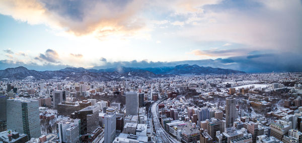 Aerial view of cityscape against sky