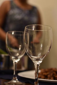 Close-up of empty wineglasses on table