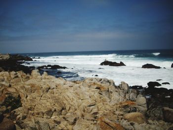 Scenic view of beach and sea against sky