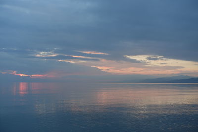 Scenic view of sea against sky at sunset