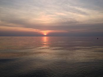 View of calm sea at sunset