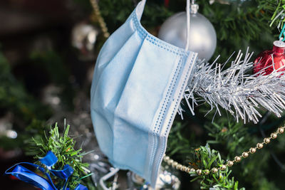 Close-up of christmas decoration hanging on plant