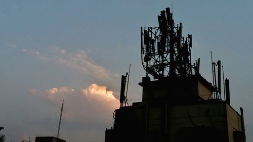 Low angle view of silhouette building against sky during sunset