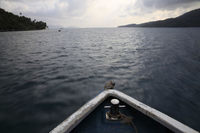 Scenic view of calm sea against cloudy sky