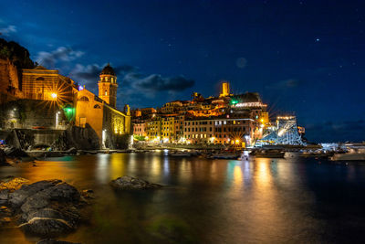 Illuminated buildings in city at night