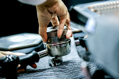 Close-up barista coffee tamper