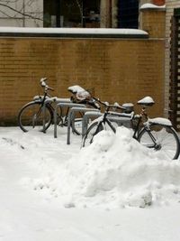 Cars parked on snow covered landscape