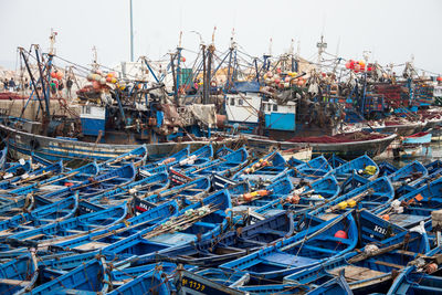 Fishing boats moored at harbor