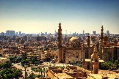 High angle view of city buildings against sky