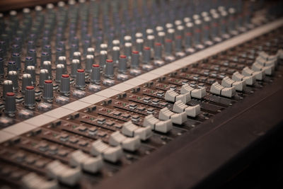 Close-up of sound mixer in recording studio