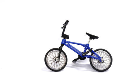 Side view of bicycle against white background