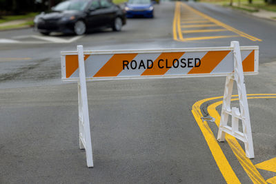 Road sign on street in city