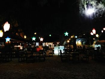 Illuminated restaurant table at night