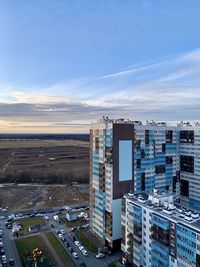 High angle view of street and buildings against sky