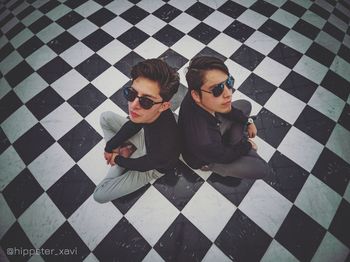 High angle view of young couple sitting on floor