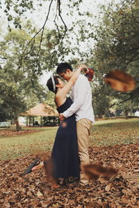 Couple sitting on a tree