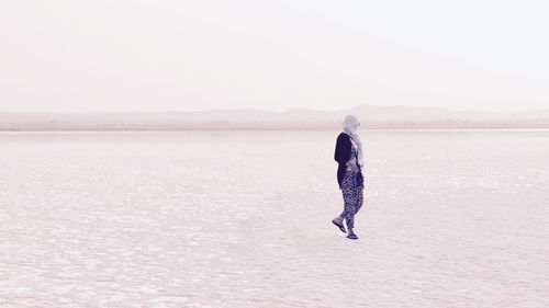 Woman standing in salt lake