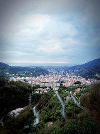 High angle view of town against cloudy sky