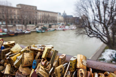 Padlocks on bridge over river