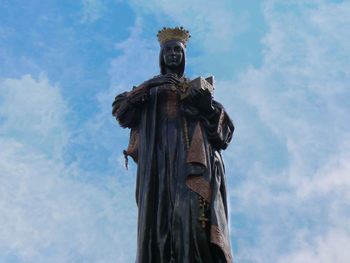 Low angle view of statue against sky