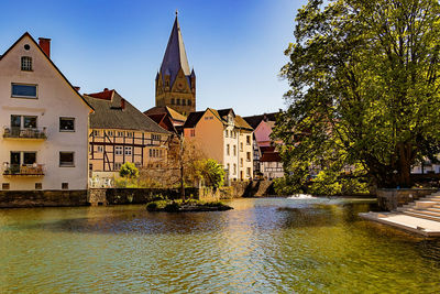 Canal against houses in town