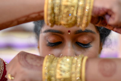 Close-up portrait of young woman with eyes closed