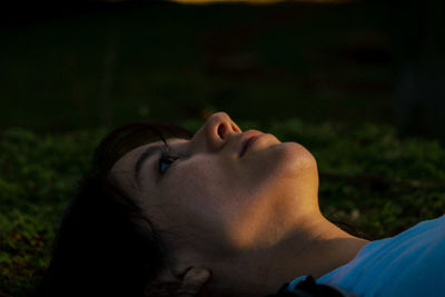 Close-up portrait of a young man lying woman