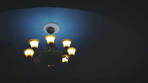 Low angle view of illuminated chandelier