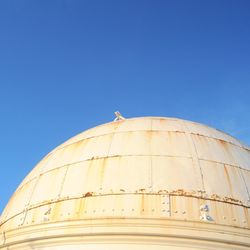 Low angle view of church against clear blue sky