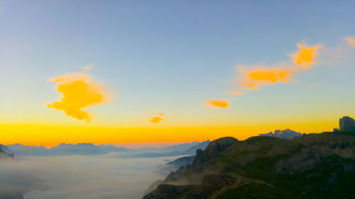 Scenic view of mountains against sky during sunset