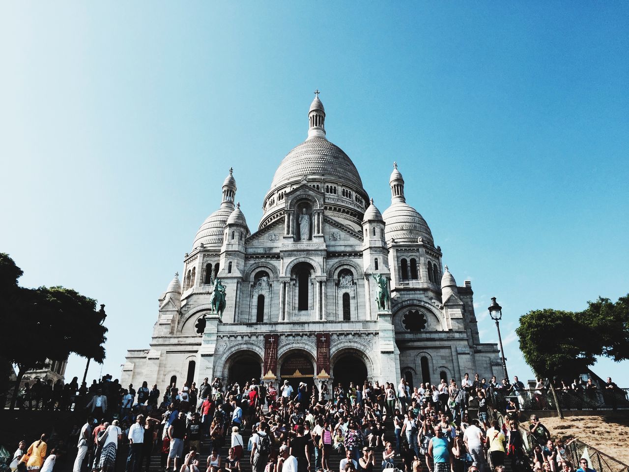 architecture, building exterior, religion, built structure, clear sky, large group of people, famous place, place of worship, tourism, dome, travel destinations, spirituality, travel, international landmark, history, tourist, blue, person