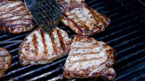 Close-up of meat on barbecue grill