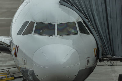 Close-up of airplane at airport runway