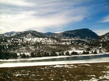 Scenic view of snowcapped mountains against sky