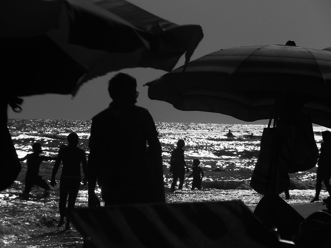 PEOPLE STANDING ON BEACH