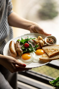 Midsection of woman having food