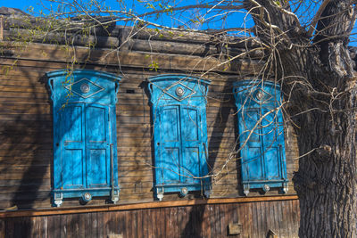 Low angle view of blue window on building