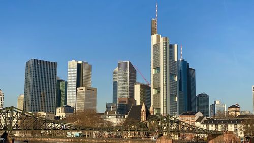 Skyscrapers in city against clear sky