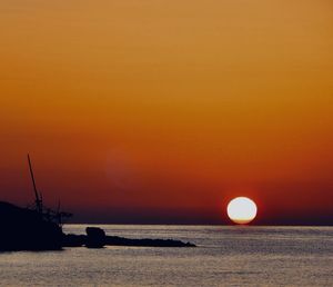 Scenic view of sea against orange sky during sunset