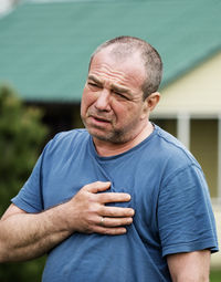 Portrait of man standing outdoors