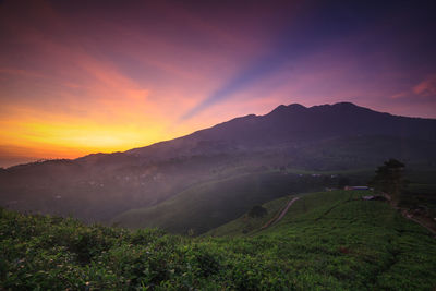 Scenic view of mountains against sky during sunset