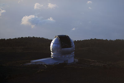 Built structure on land against sky