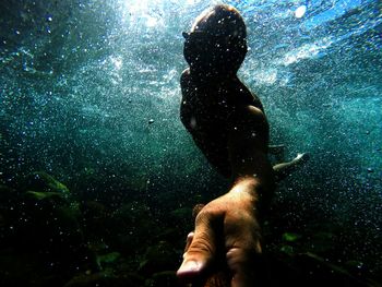 Reflection of woman in water