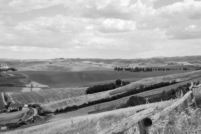 Scenic view of agricultural field against sky