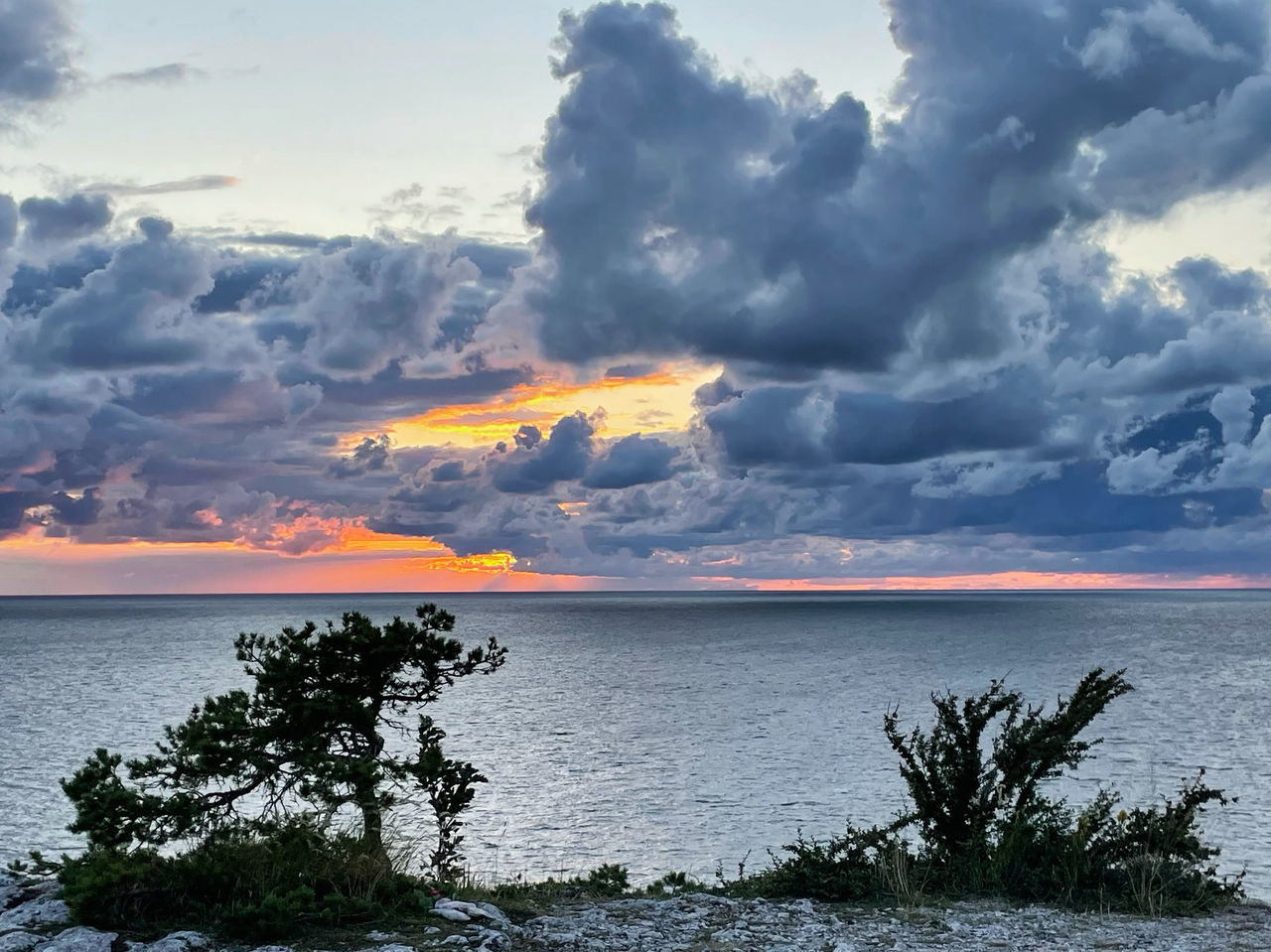 sky, water, cloud, sea, beauty in nature, ocean, horizon, nature, coast, scenics - nature, shore, land, environment, sunset, tree, beach, plant, horizon over water, dusk, landscape, no people, tranquility, dramatic sky, seascape, travel destinations, outdoors, travel, tranquil scene, evening, body of water, bay, cloudscape, coastline, reflection, tropical climate, wave, sunlight, storm, tourism